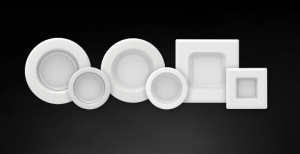 A photo of a sleek wafer light fixture in use, emitting a contemporary and efficient light.